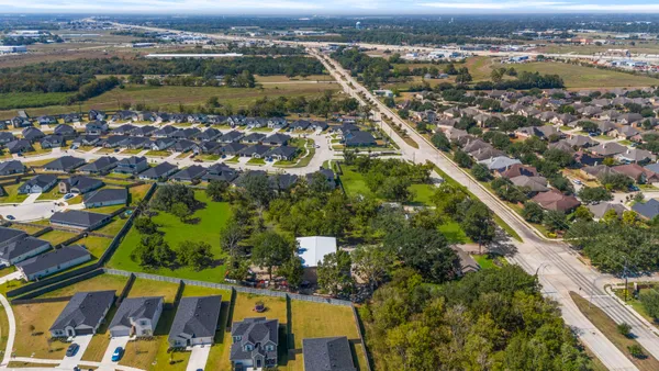 an aerial view of residential houses with outdoor space