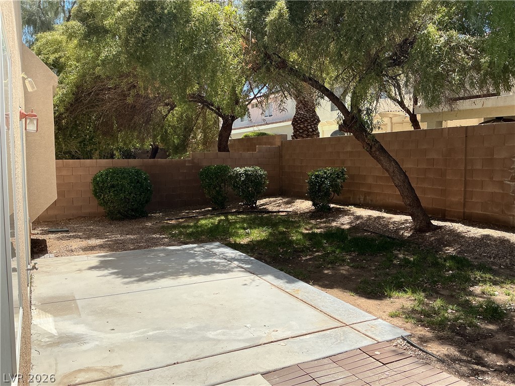 10975 Calcedonian Street Las Vegas, NV 89141 - Photo 25 of 25 This private yard features a concrete patio, perfect for outdoor relaxation.