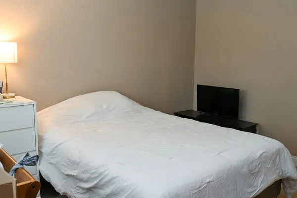 a bed in a bedroom with a bed