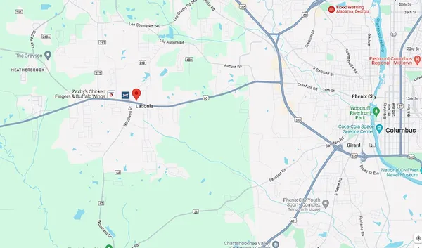 a bathroom with a bathtub and mirror