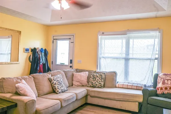 a living room with furniture and a window