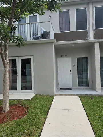 a house view with a garden space