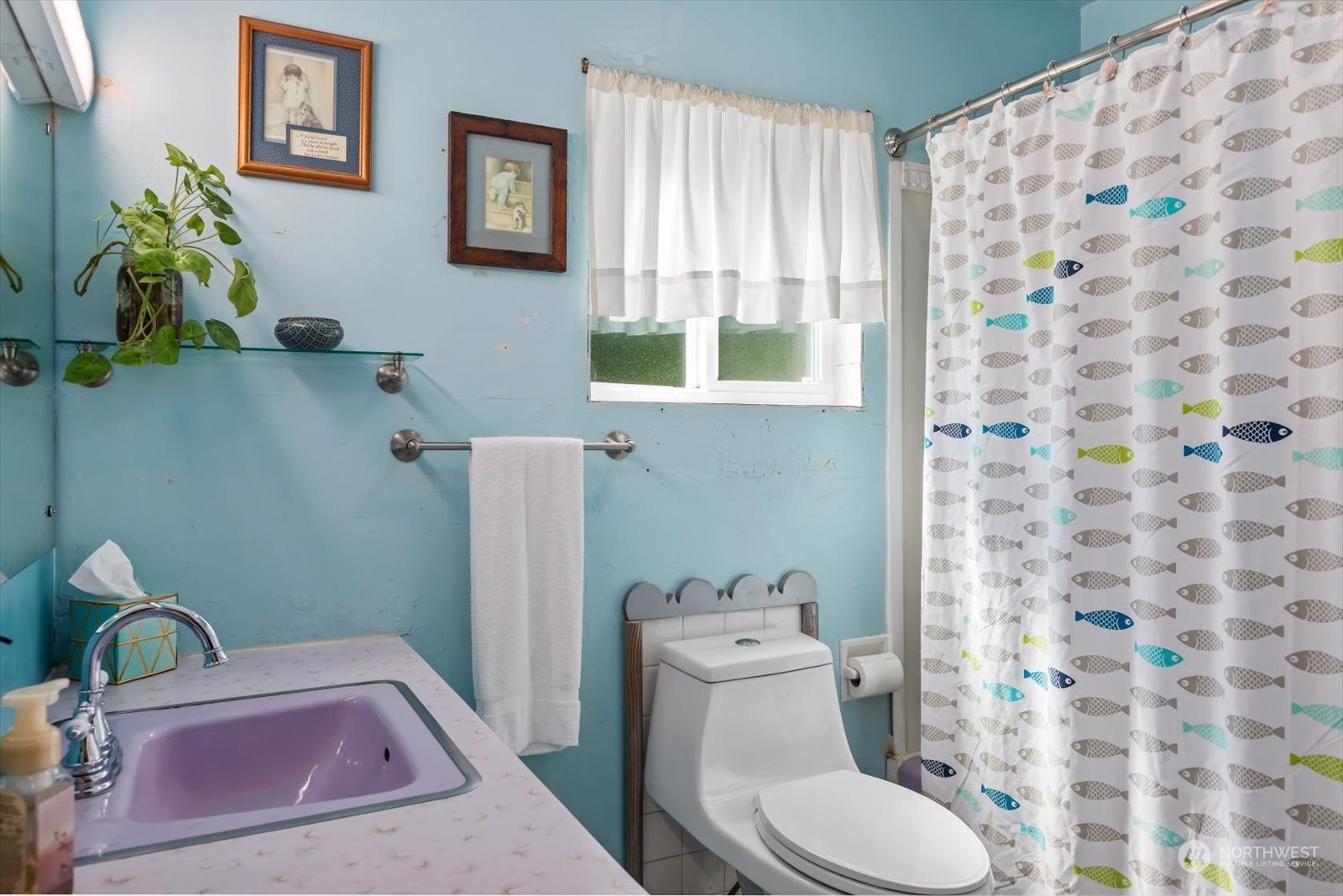 1306 38th Street Everett, WA 98201 - Photo 16 of 37 a bathroom with a granite countertop toilet sink and mirror