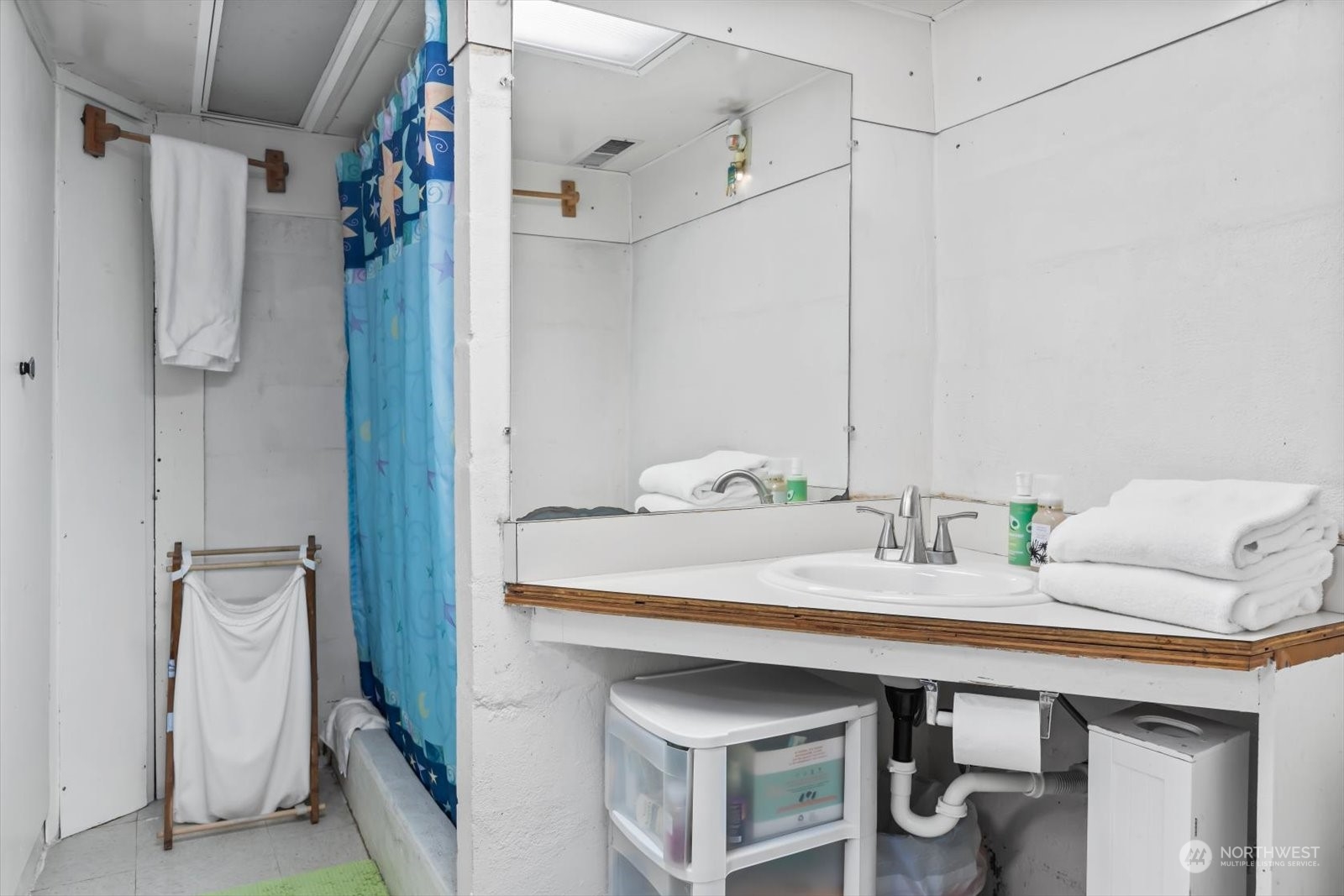 1306 38th Street Everett, WA 98201 - Photo 24 of 37 a bathroom with a sink and a mirror