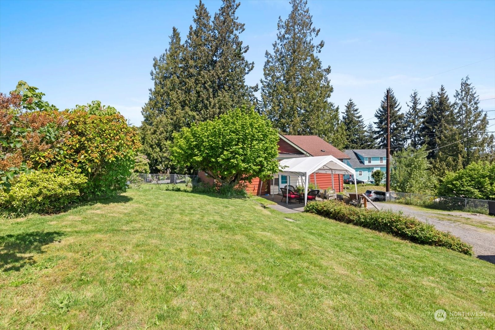 1306 38th Street Everett, WA 98201 - Photo 28 of 37 a front view of a house with a yard and trees