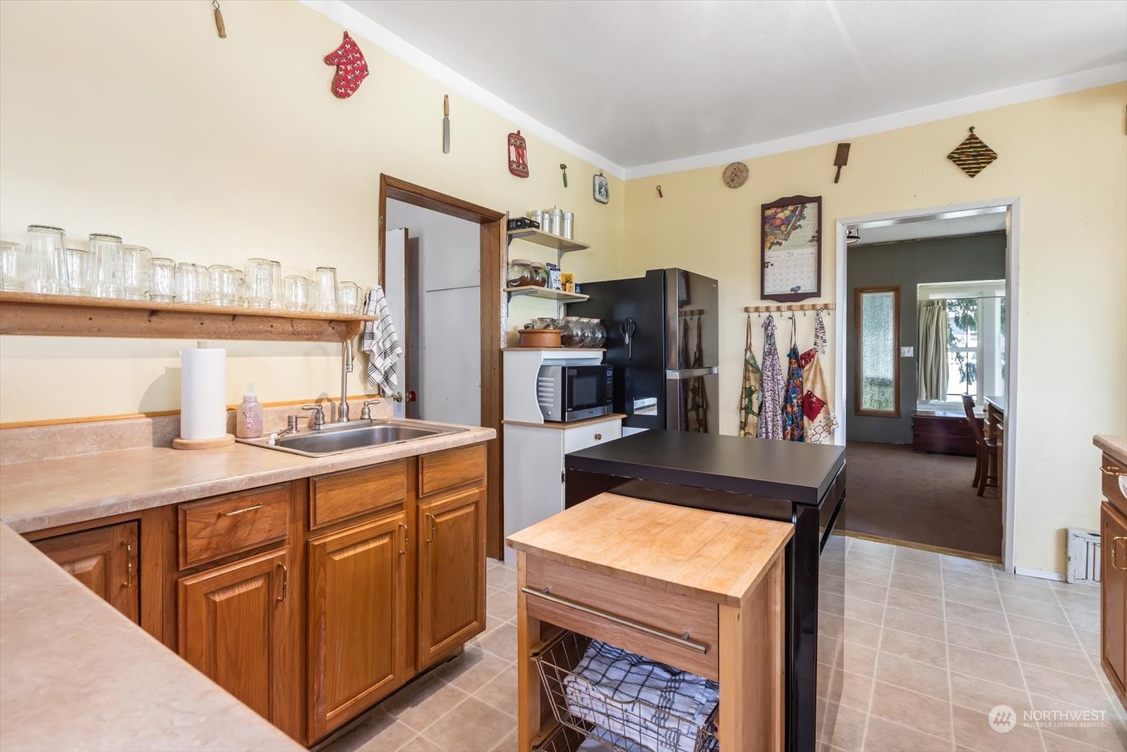 1306 38th Street Everett, WA 98201 - Photo 3 of 37 a kitchen with stainless steel appliances kitchen island granite countertop a sink and cabinets