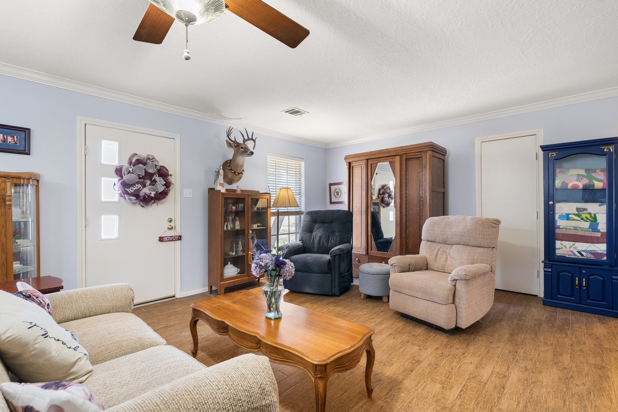 12156 Crockett Martin Road Conroe, TX 77306 - Photo 12 of 45 a living room with furniture and a flat screen tv