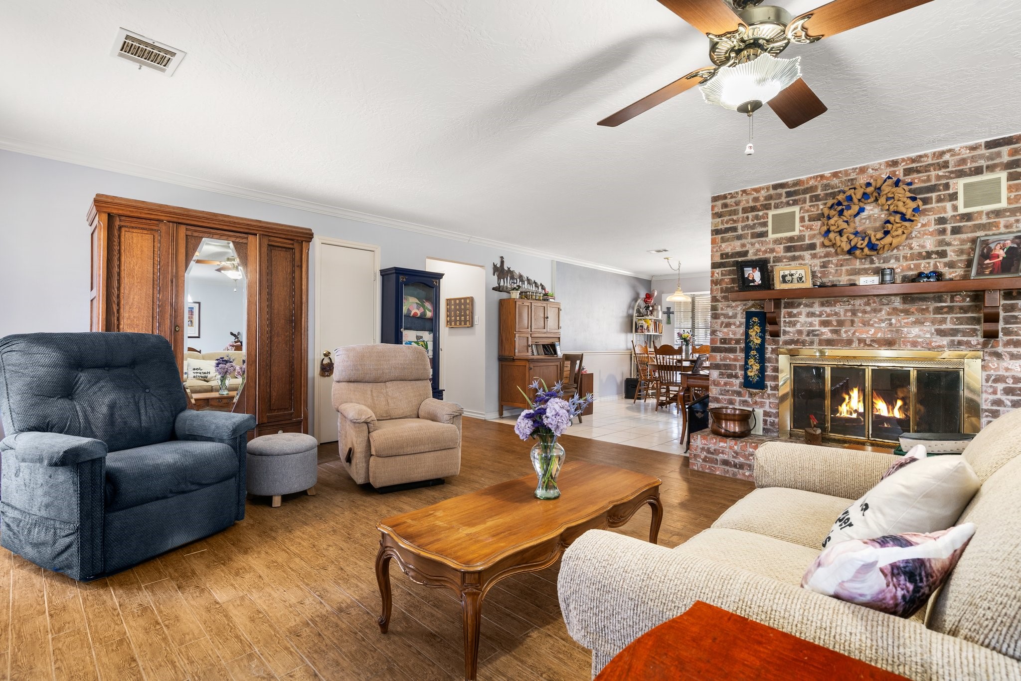 12156 Crockett Martin Road Conroe, TX 77306 - Photo 15 of 45 a living room with furniture and a fireplace