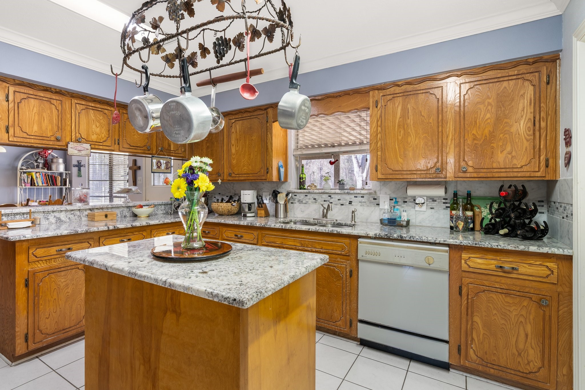 12156 Crockett Martin Road Conroe, TX 77306 - Photo 20 of 45 a kitchen with sink cabinets and window