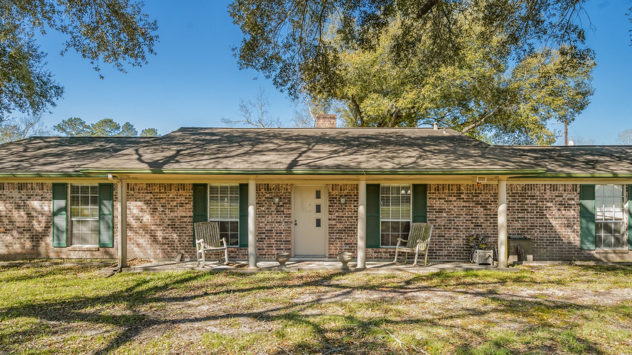 12156 Crockett Martin Road Conroe, TX 77306 - Photo 2 of 45 front view of a house with a trees