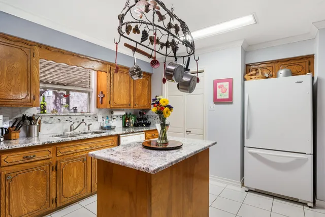 a kitchen with a refrigerator and countertop