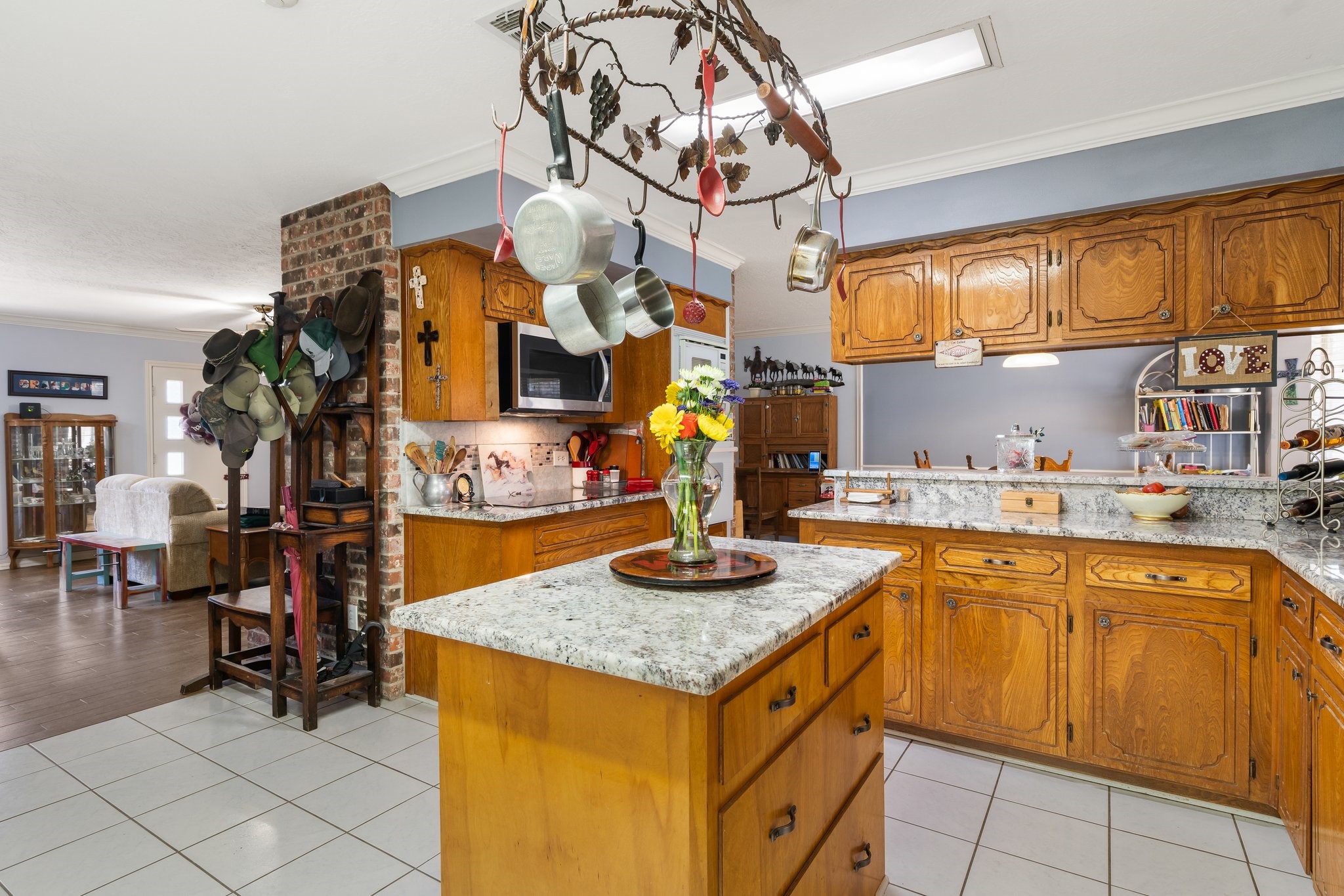 12156 Crockett Martin Road Conroe, TX 77306 - Photo 23 of 45 a kitchen with stainless steel appliances granite countertop a sink and cabinets