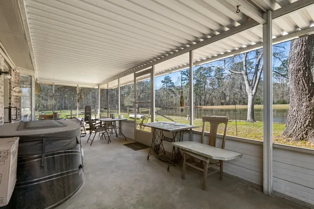 a view of a swimming pool with an outdoor seating and a garden