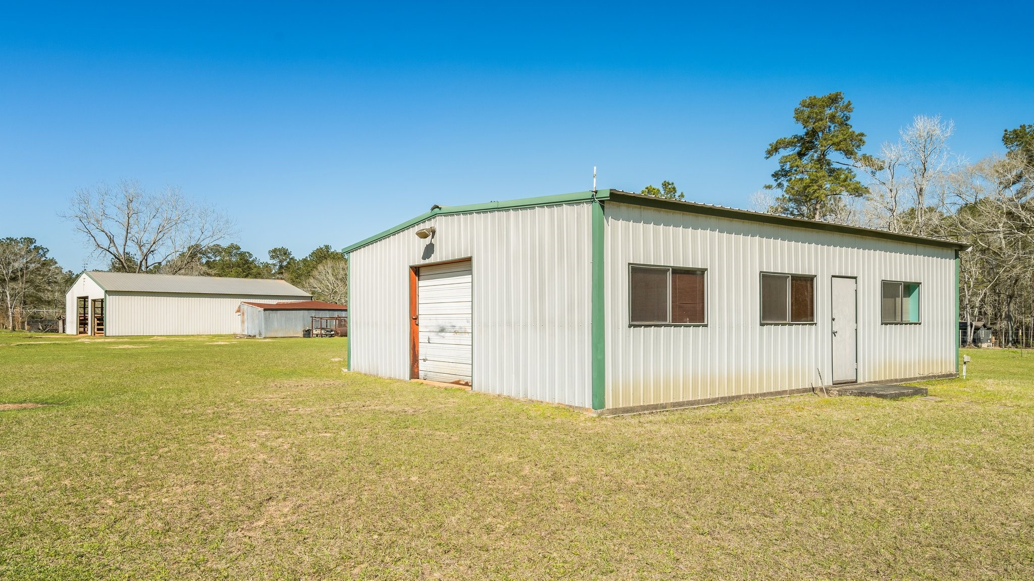 12156 Crockett Martin Road Conroe, TX 77306 - Photo 39 of 45 a view of a house with a yard