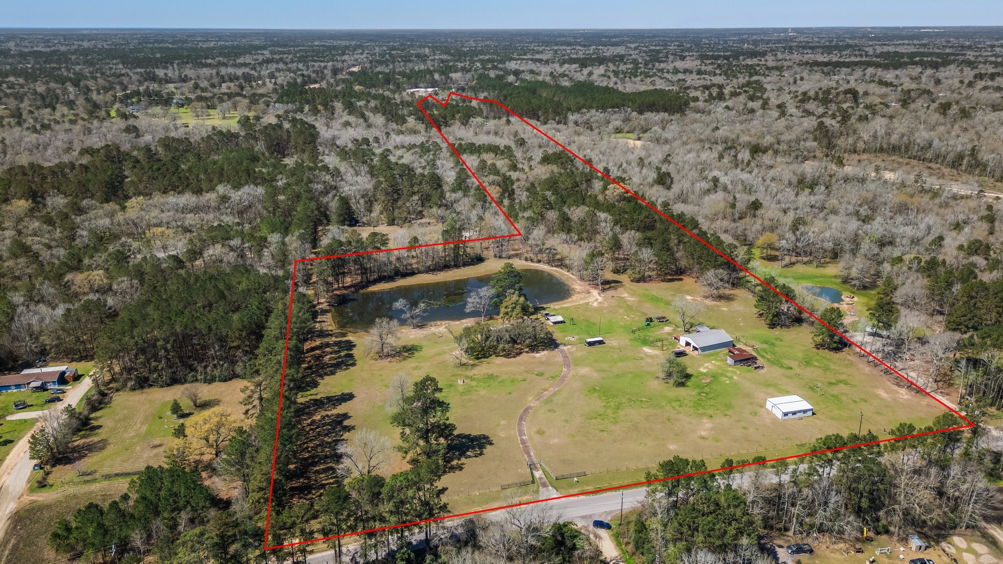 12156 Crockett Martin Road Conroe, TX 77306 - Photo 45 of 45 an aerial view of residential houses with outdoor space