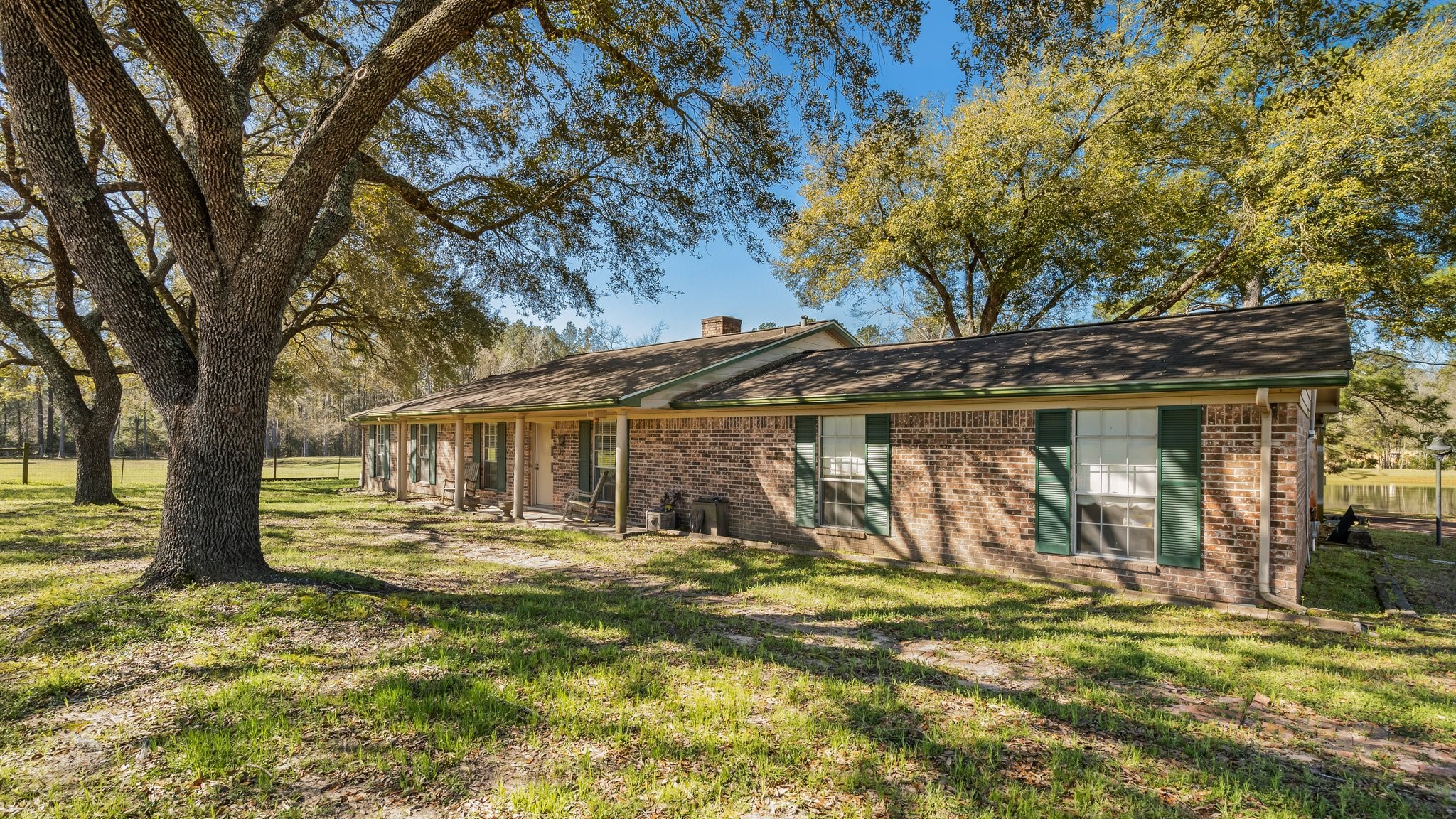 12156 Crockett Martin Road Conroe, TX 77306 - Photo 9 of 45 a view of a house with a large tree