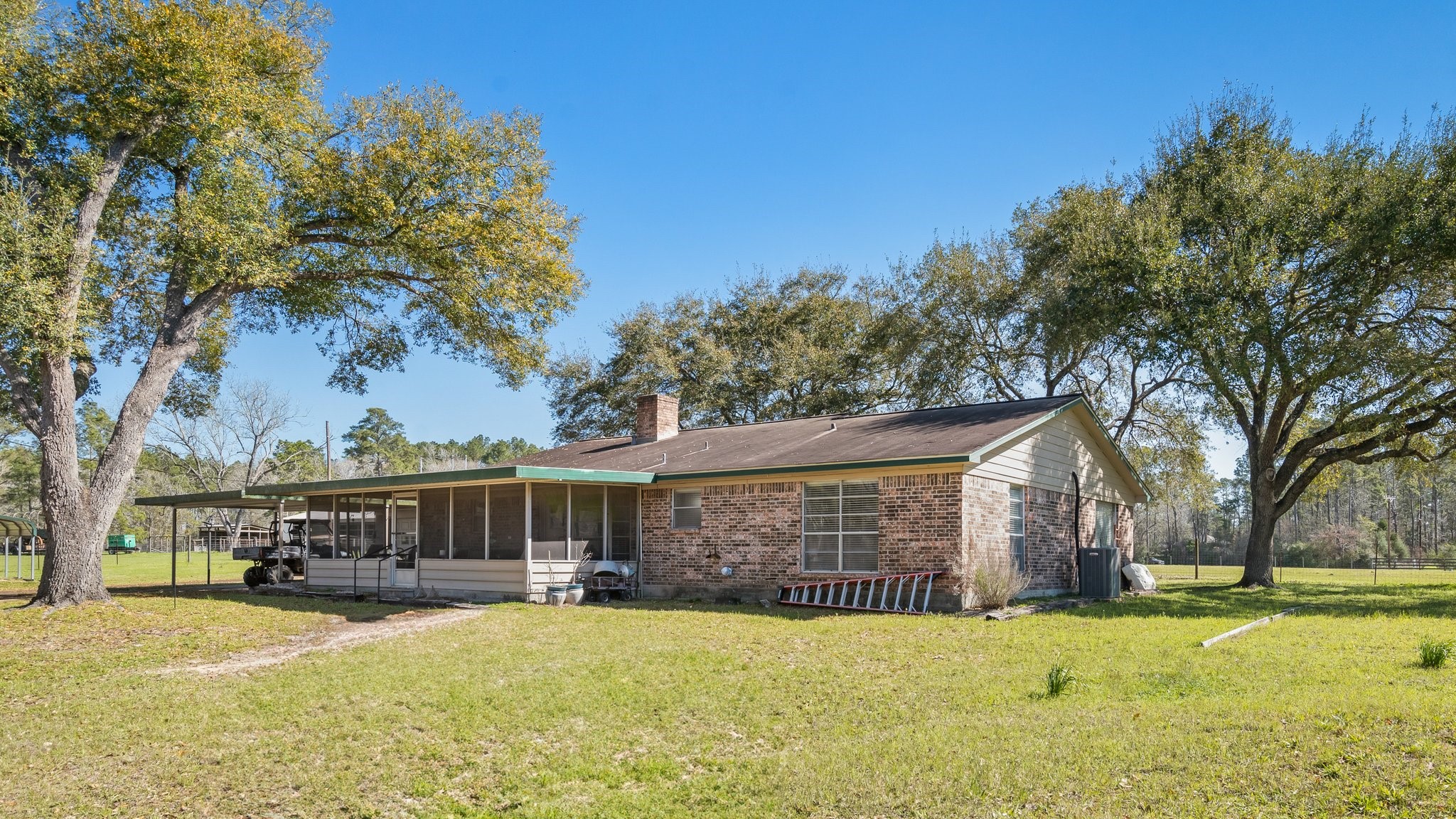 12156 Crockett Martin Road Conroe, TX 77306 - Photo 10 of 45 a front view of house with yard and trees in the background