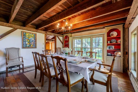 a dining room with furniture and window