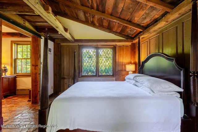 a view of a dining room with furniture and window