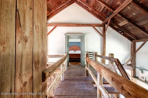 a spacious bathroom with a double vanity sink a mirror and bathtub