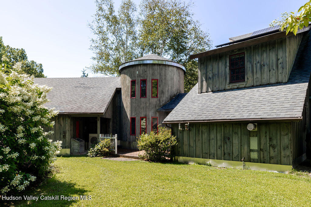 455 Post Hill Road Craryville, NY 12521 - Photo 2 of 53 a front view of a house with a yard