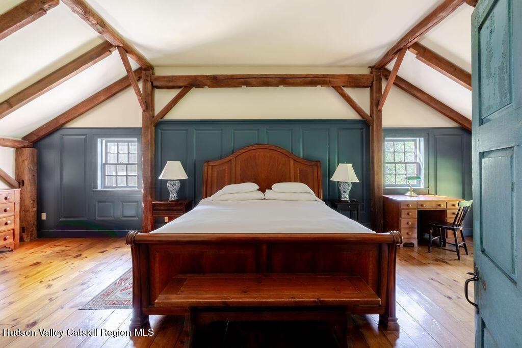 455 Post Hill Road Craryville, NY 12521 - Photo 21 of 53 a bedroom with a bed a table and chair