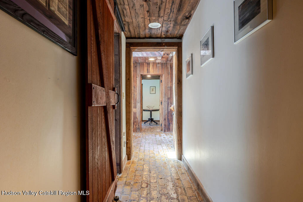455 Post Hill Road Craryville, NY 12521 - Photo 31 of 53 a view of a hallway with wooden floor and staircase