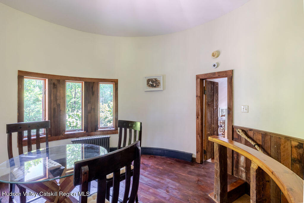 455 Post Hill Road Craryville, NY 12521 - Photo 36 of 53 a view of a a dining room with furniture window and wooden floor