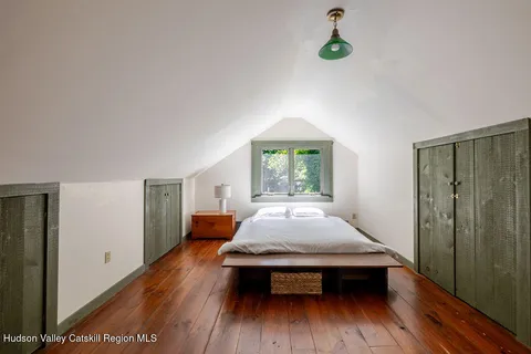 a front view of house with a garden