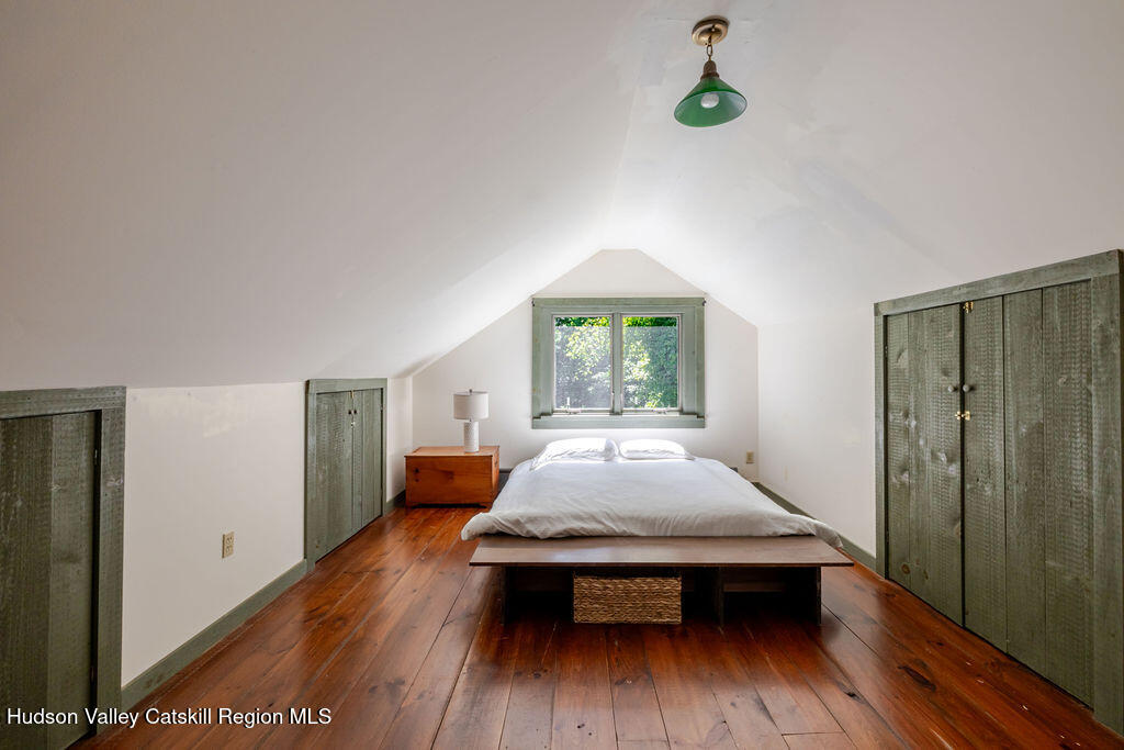455 Post Hill Road Craryville, NY 12521 - Photo 37 of 53 a living room with a bed and wooden floor