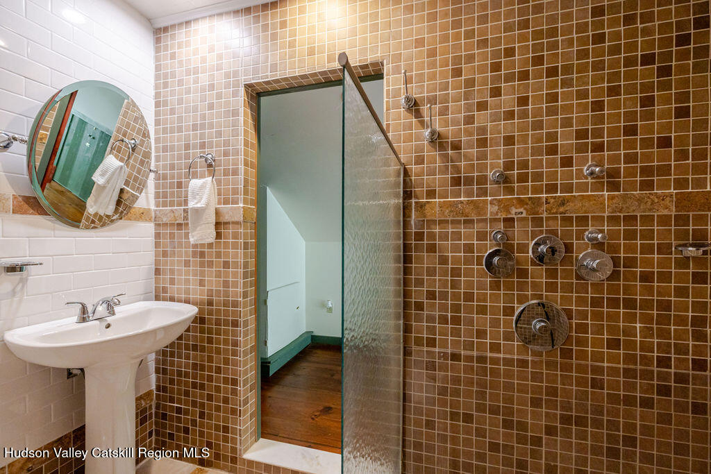455 Post Hill Road Craryville, NY 12521 - Photo 39 of 53 a bathroom with a sink and a mirror