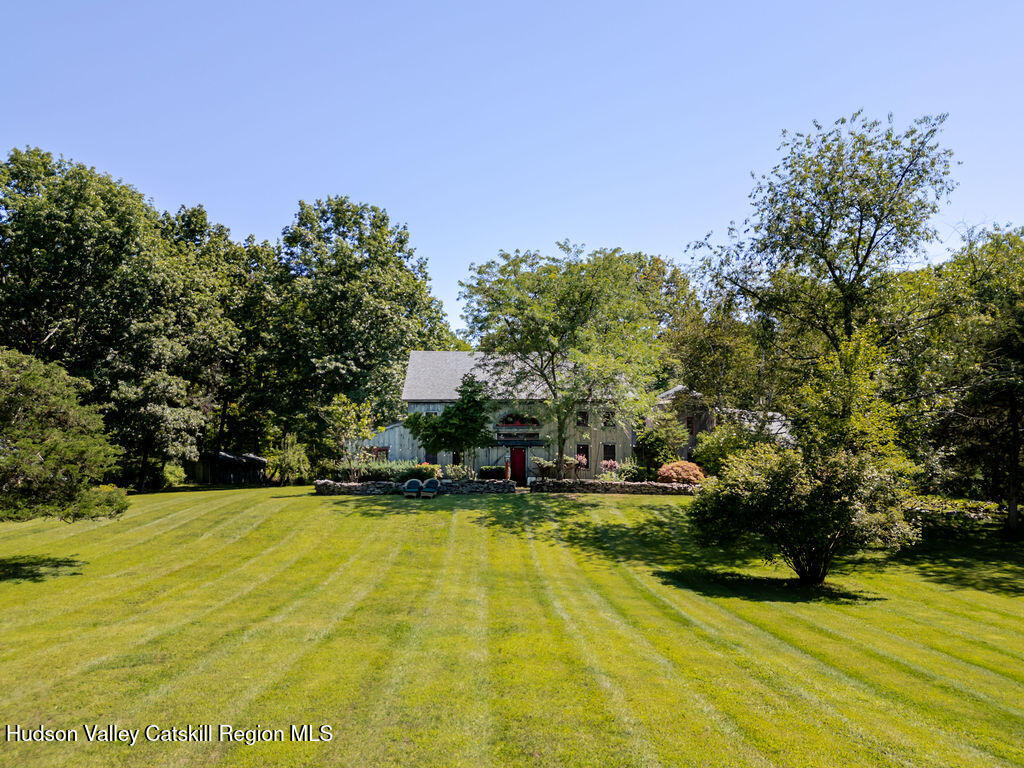 455 Post Hill Road Craryville, NY 12521 - Photo 49 of 53 a view of a swimming pool with an outdoor space and seating area
