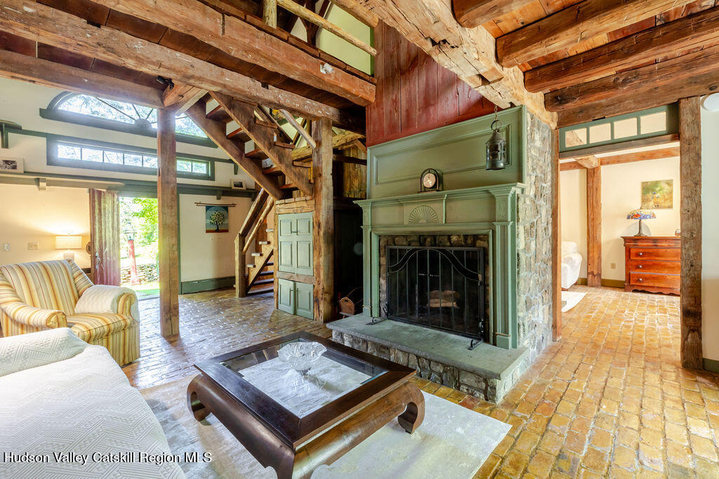 455 Post Hill Road Craryville, NY 12521 - Photo 10 of 53 a living room with couch and a fireplace
