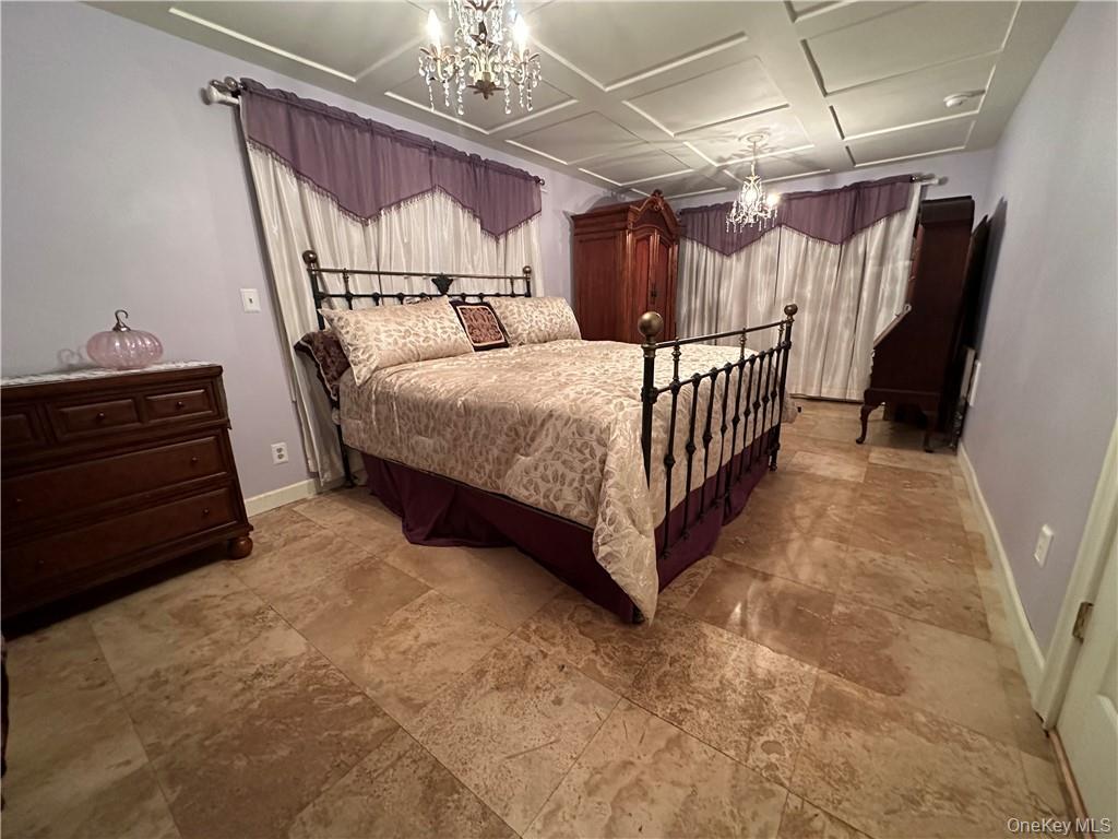 256 Ridge Road Campbell Hall, NY 10916 - Photo 12 of 36 Bedroom with a notable chandelier and coffered ceiling