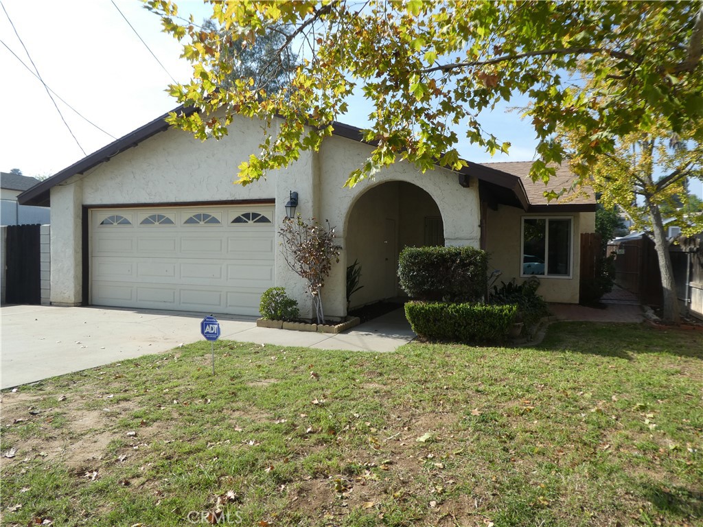 3842 Ridge Road Riverside, CA 92501 - Photo 3 of 26 a front view of a house with garden
