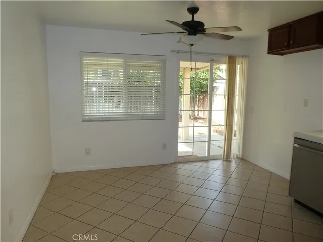 a view of an empty room and a window