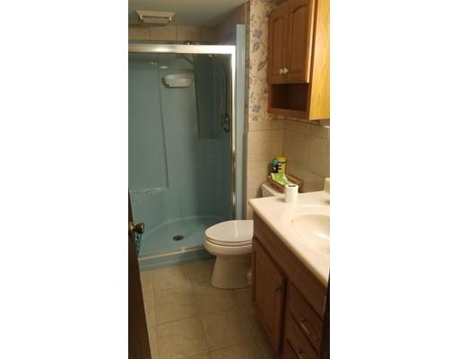 308 Beaver Lake Road Ware, MA 01082 - Photo 22 of 24 a bathroom with a granite countertop toilet a sink and a mirror