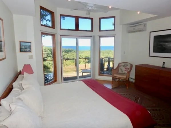 a bedroom with a bed and a couch