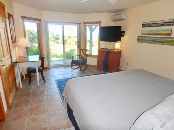 29 Cemetery Road Chilmark, MA 02535 - Photo 22 of 32 a living room with furniture and a flat screen tv