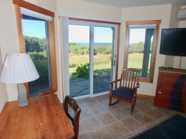 29 Cemetery Road Chilmark, MA 02535 - Photo 6 of 32 a bedroom with a bed and a window