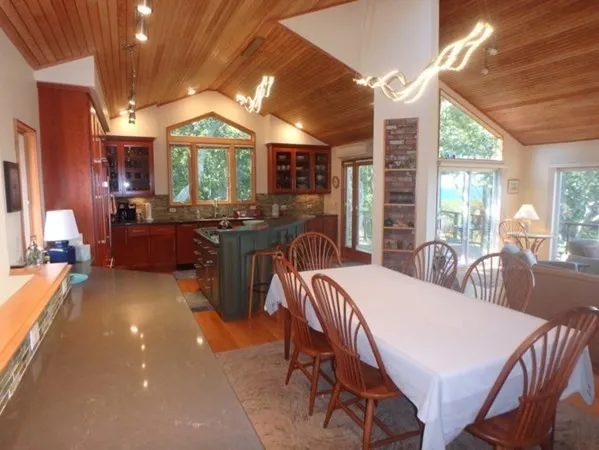 a view of a dining room with furniture window and outside view