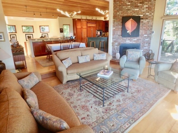 29 Cemetery Road Chilmark, MA 02535 - Photo 8 of 32 a living room with furniture and a fireplace