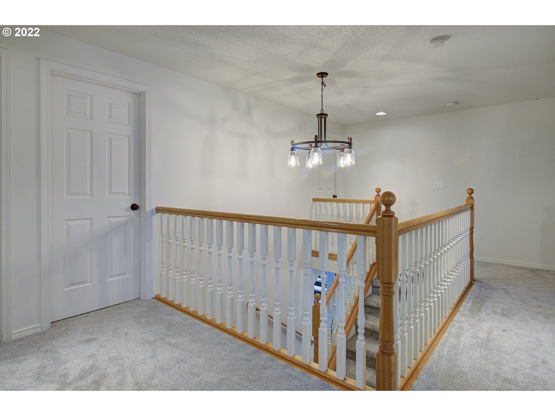 810 Raven Drive Ridgefield, WA 98642 - Photo 15 of 32 a view of a livingroom with wooden floor and staircase