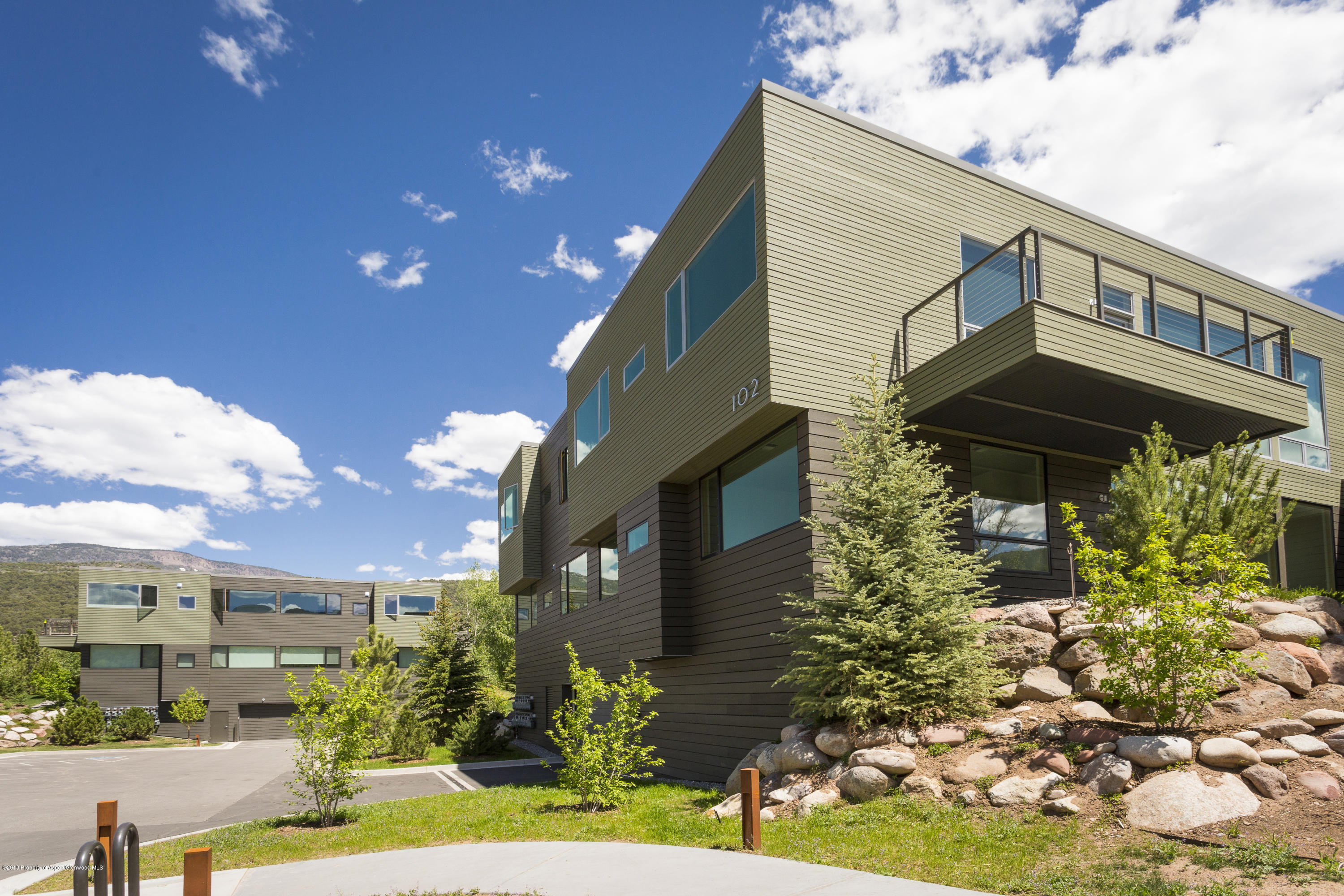 100 Evans Road, Unit 104 Basalt, CO 81621 - Photo 23 of 24 a front view of a house with a yard