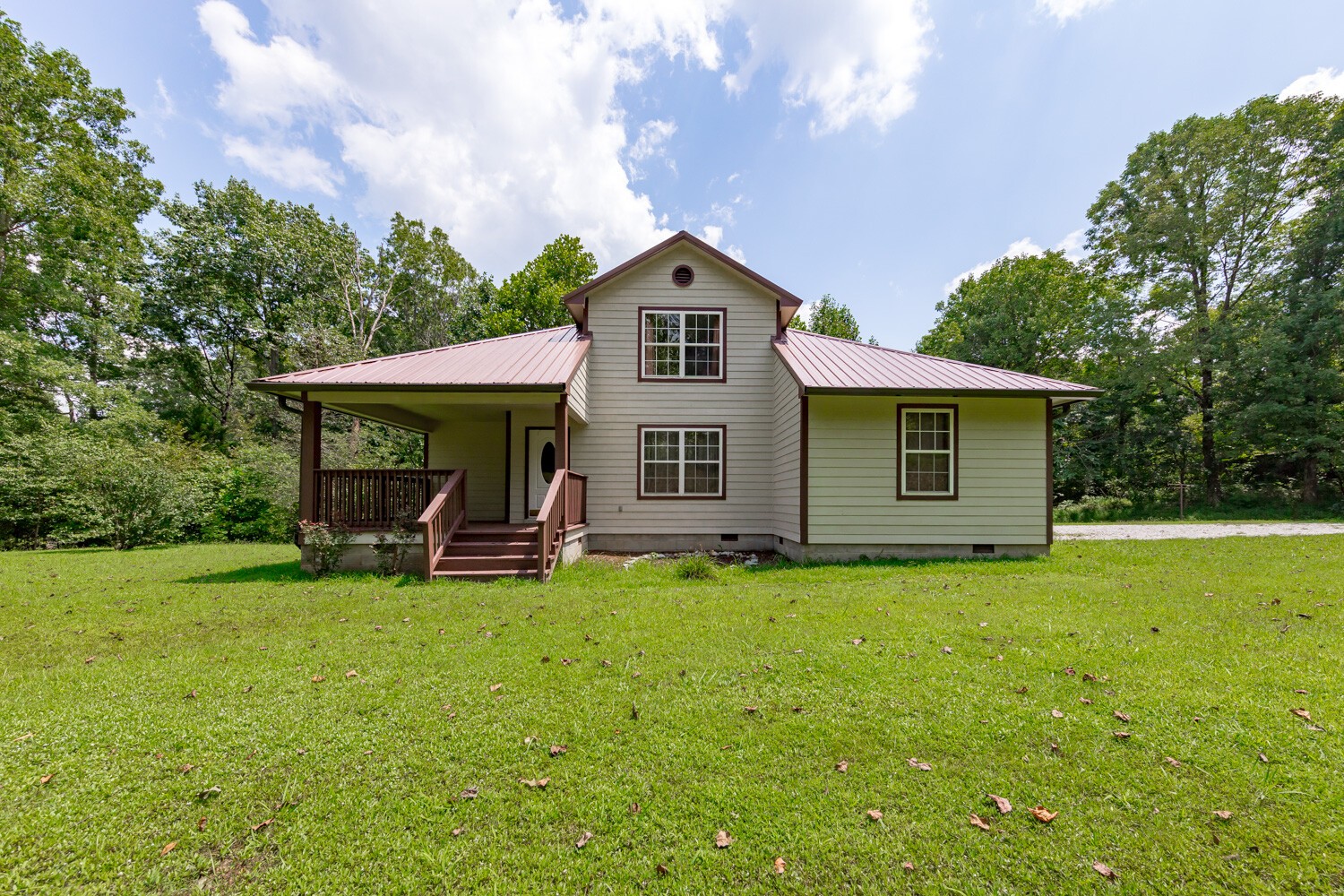 415 French Hill Road Tennessee Ridge, TN 37178 - Photo 2 of 48 a front view of a house with patio and garden
