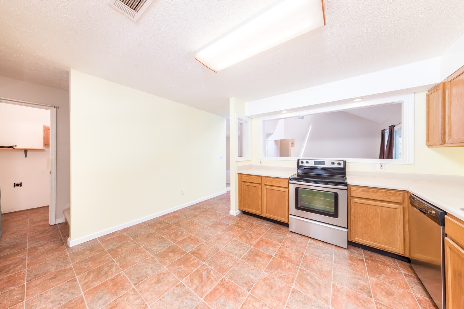 415 French Hill Road Tennessee Ridge, TN 37178 - Photo 14 of 48 a large kitchen with stainless steel appliances granite countertop a stove a sink and a refrigerator