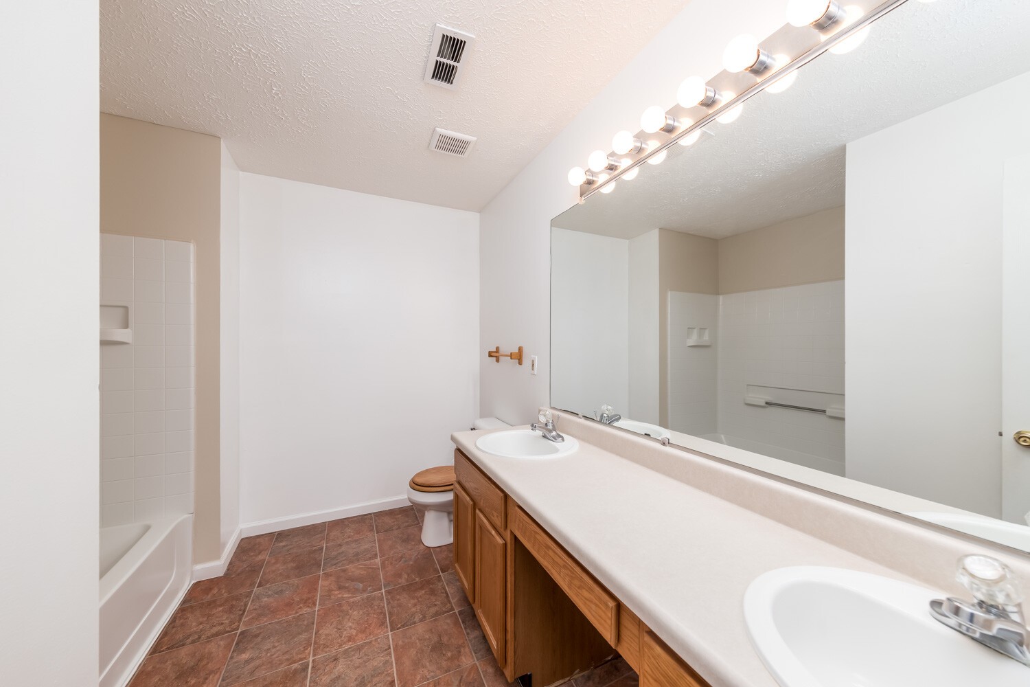 415 French Hill Road Tennessee Ridge, TN 37178 - Photo 32 of 48 a spacious bathroom with a double vanity sink and a mirror