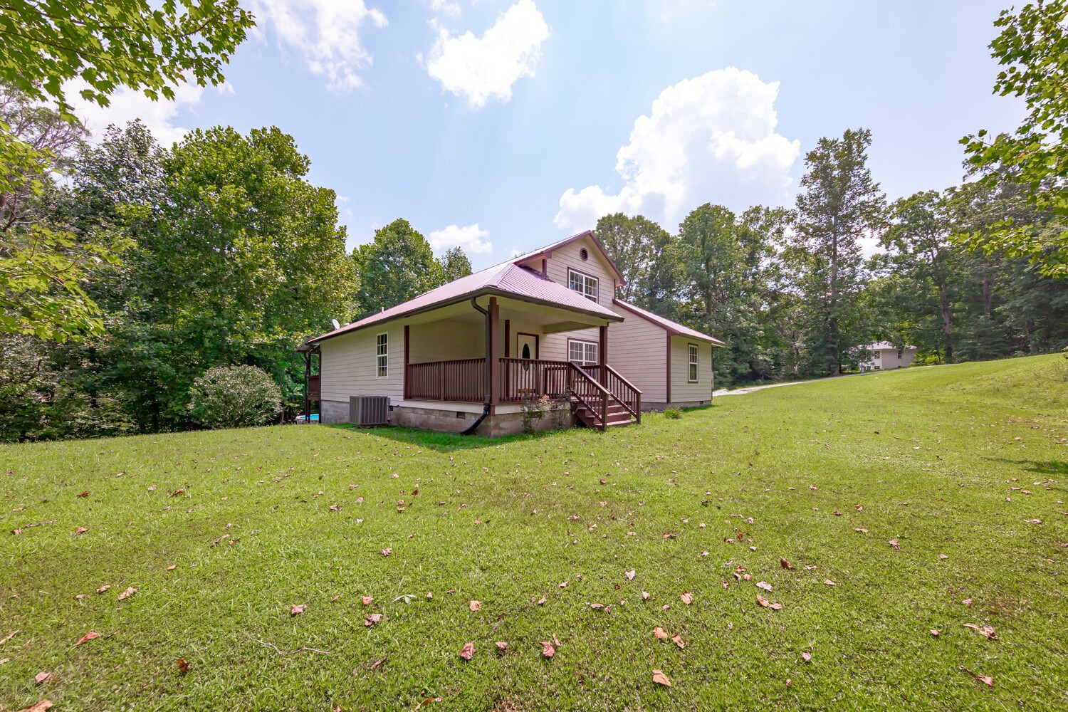 415 French Hill Road Tennessee Ridge, TN 37178 - Photo 41 of 48 a yellow house with a big yard plants and large trees