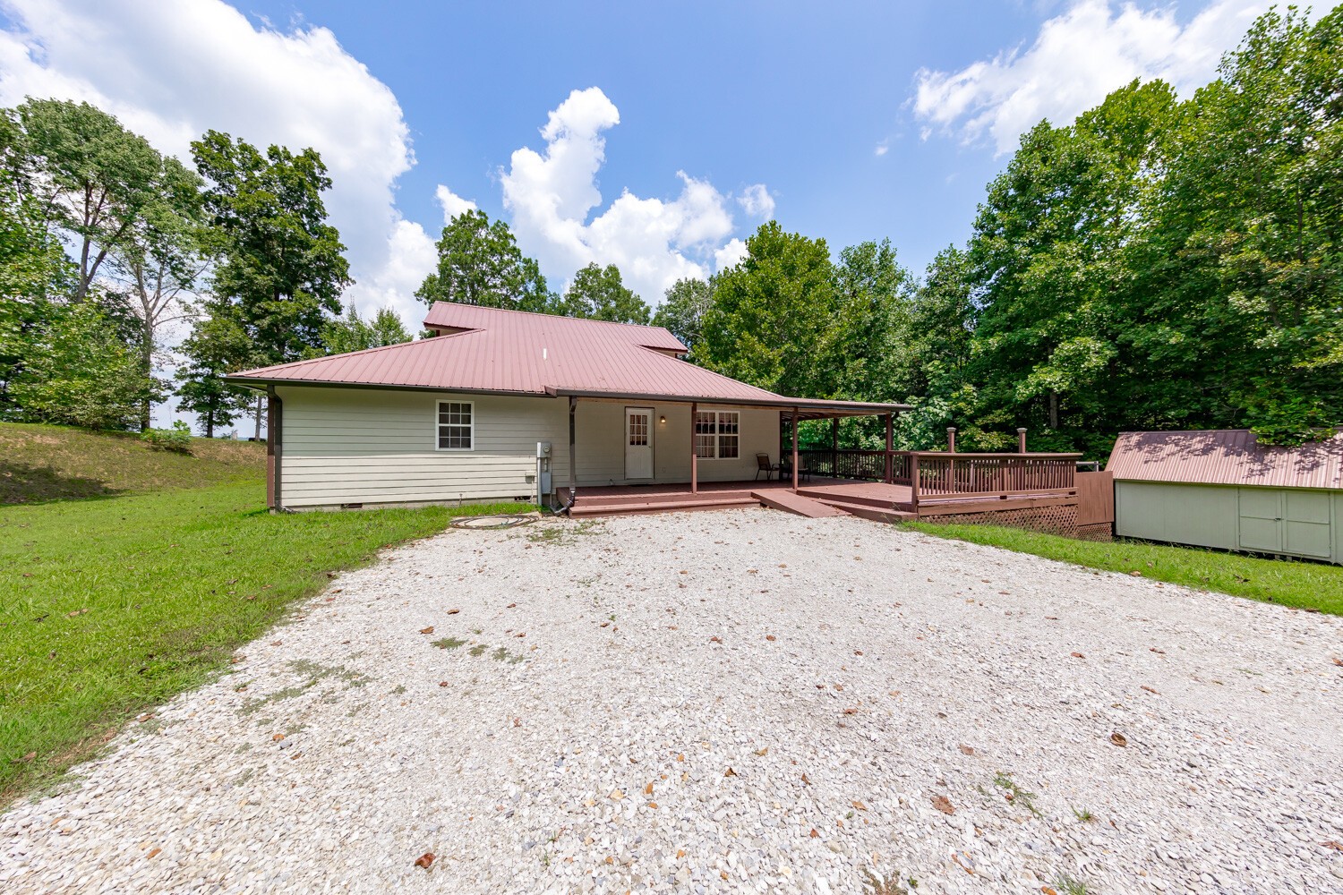 415 French Hill Road Tennessee Ridge, TN 37178 - Photo 43 of 48 a house with a yard and a large tree