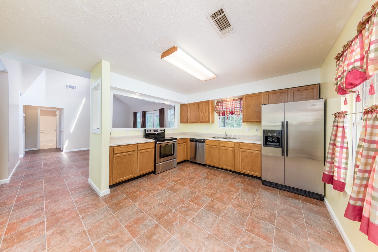 415 French Hill Road Tennessee Ridge, TN 37178 - Photo 9 of 48 a kitchen with stainless steel appliances granite countertop a refrigerator and a sink